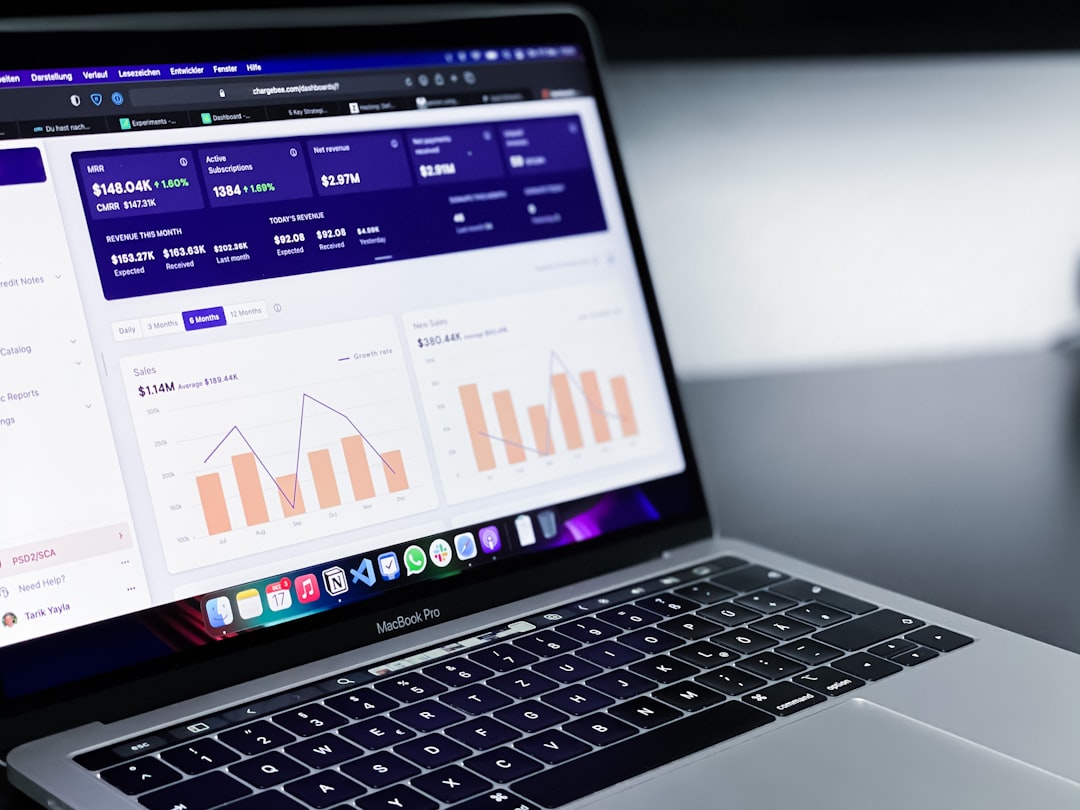A laptop in an office setting representing financial dashboards and automation workflows